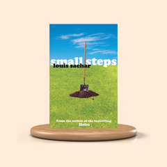 Book cover of 'Small Steps' by Louis Sachar on a wooden stand with a beige background