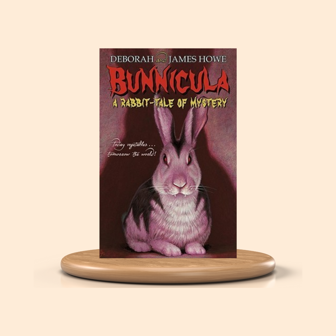 Book titled 'Bunnicula: A Rabbit-Tale of Mystery' by Deborah and James Howe on a wooden stand with a beige background.