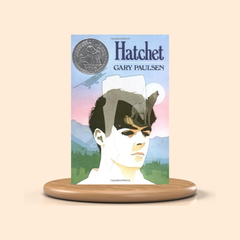 Book titled 'Hatchet' by Gary Paulsen on a beige background