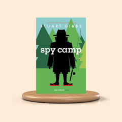 Book cover of 'Spy Camp' by Stuart Gibbs on a beige background