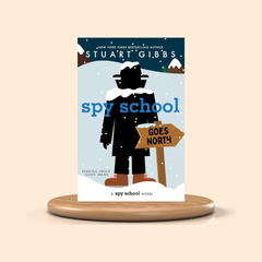 Book cover of 'Spy School Goes North' by Stuart Gibbs on a beige background